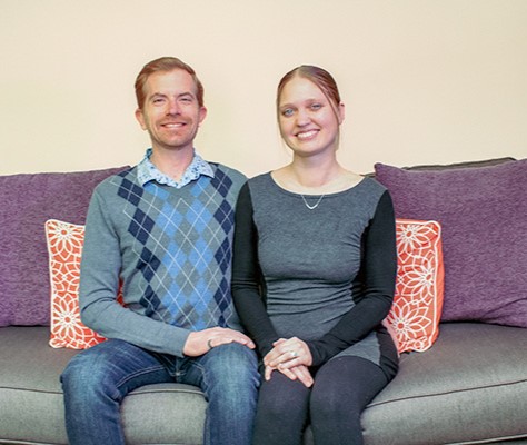 Picture of couple sitting on a couch